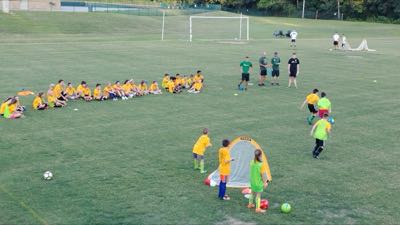 Campers and trainers on the pitch