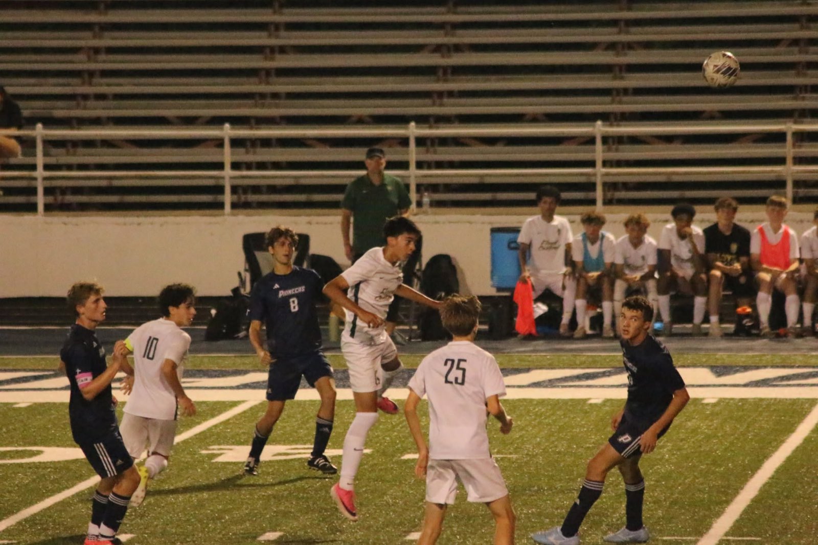 Battling for the ball against the Pioneers