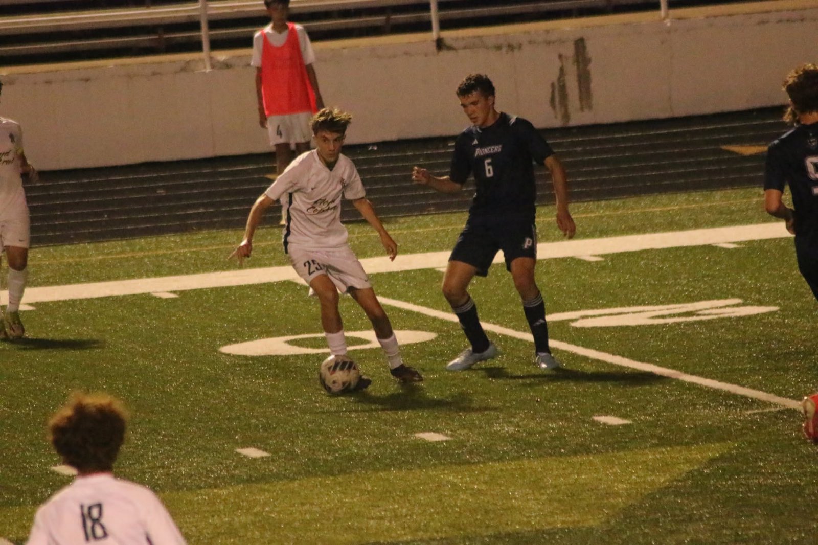 Rising for the header in front of the bench
